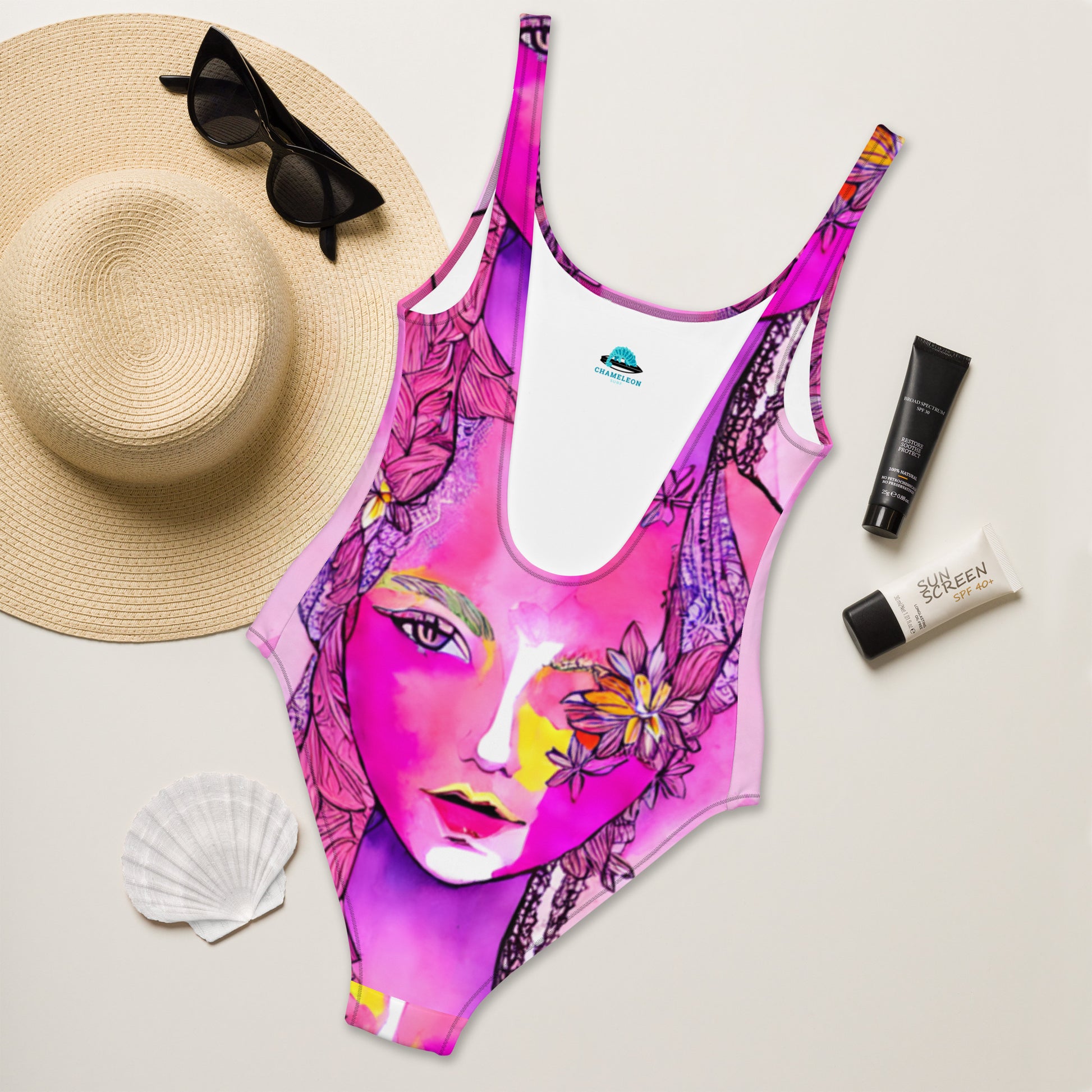 Introducing the Pink Bohemian Goddess One-Piece Swimsuit by Chameleon Surf Brand! Dive into summer style with this chic and eco-friendly swimsuit. Made for the modern goddess who embraces both fashion and sustainability. Get ready to make a splash and stand out on the beach or by the pool. Shop now and channel your inner beach bae #SummerStyle #ChameleonSurf #PinkGoddessSwimsuit #greenswimsuit #pinkbathingsuit #cheekyswimsuit