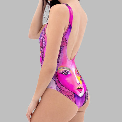 Introducing the Pink Bohemian Goddess One-Piece Swimsuit by Chameleon Surf Brand! Dive into summer style with this chic and eco-friendly swimsuit. Made for the modern goddess who embraces both fashion and sustainability. Get ready to make a splash and stand out on the beach or by the pool. Shop now and channel your inner beach bae #SummerStyle #ChameleonSurf #PinkGoddessSwimsuit #greenswimsuit #pinkbathingsuit #cheekyswimsuit